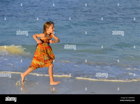 Cute Little Girl Running On Beach In Sunset Light Cuba Stock Photo Alamy