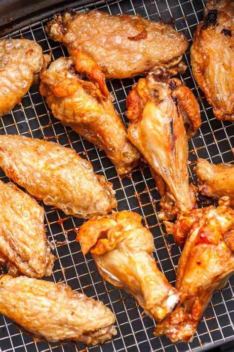 Air fryer chicken wings are crisped in the air fryer with just a drizzle of oil and pinch of seasonings. Easy Air Fryer Chicken Wings are so crispy and delicious ...