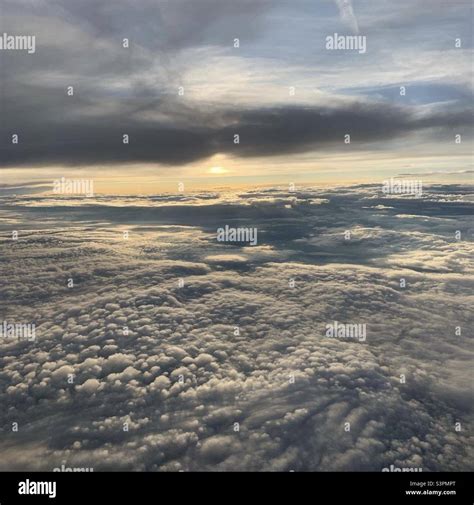 Sun And Sky Above Clouds View From Plane High Altitude Stock Photo