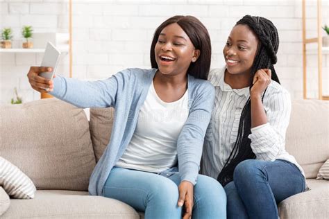 Two Black Female Friends Taking Selfie Having Fun At Home Stock Image Image Of Female