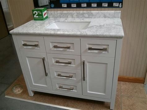 Bathroom vanities are a combination of both the sink and the surrounding storage and are sold in an endless array of sizes, finishes and styles. Menards vanity $799 - may change out handles. Size shown ...