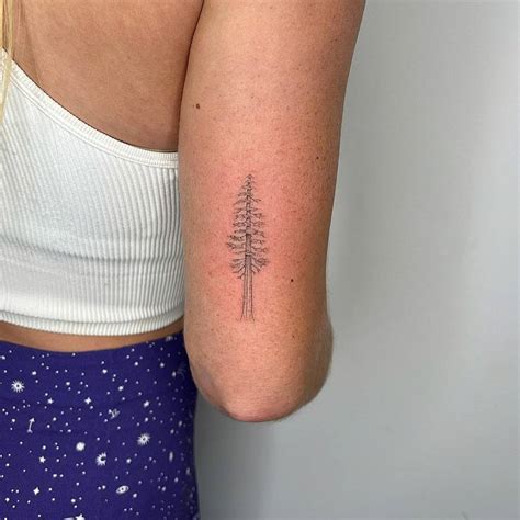 Single Needle Pine Tree Tattoo On The Tricep