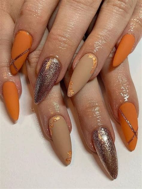 Stiletto Shaped Burnt Orange Gold And Nude Manicure Orange Nails