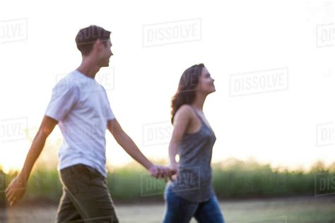 Couple Taking Walk Together Outdoors Stock Photo Dissolve