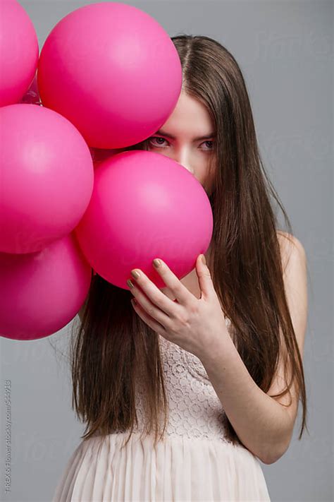 Girl With Pink Balloons By T Rex And Flower Balloon Girl Stocksy United
