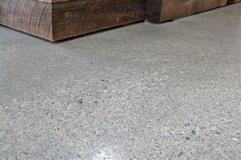 The idea of a modern kitchen and the seemingly traditional notion of a rough concrete floor might seem at odds on the surface of it all. Diamond in the Rough: A Decorative Concrete Floor