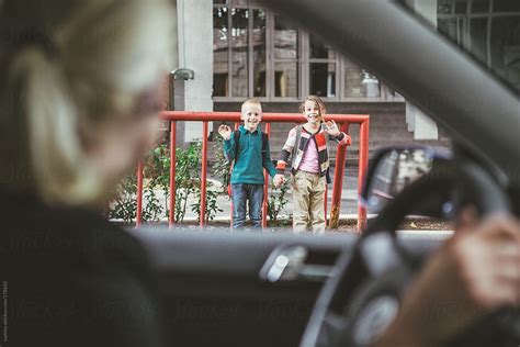 Mother Dropping Kids Off At School By Stocksy Contributor Lumina