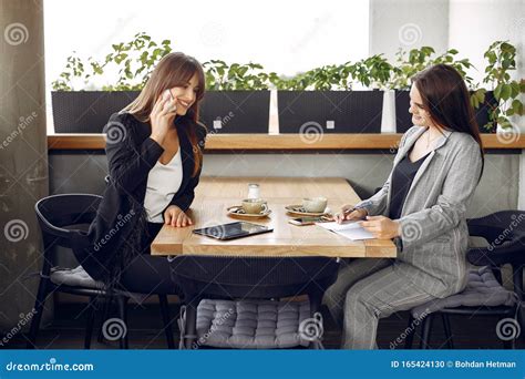 Two Businesswomen Working In A Cafe Stock Photo Image Of People