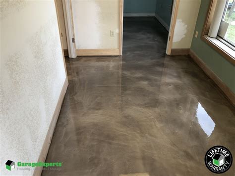 A metallic epoxy garage floor coating is one of the most popular ways to use metallic epoxy. Antique Silver Metallic Epoxy Flooring Install Cocoa Florida | Garage Experts of Brevard