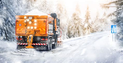 Salting Highway Maintenance Snow Plow Truck On Snowy Road In Action