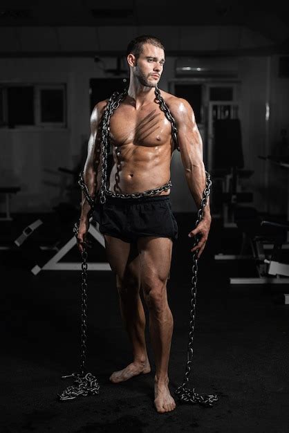 Premium Photo Muscular Man Slave In Chains In Gym The Prisoner