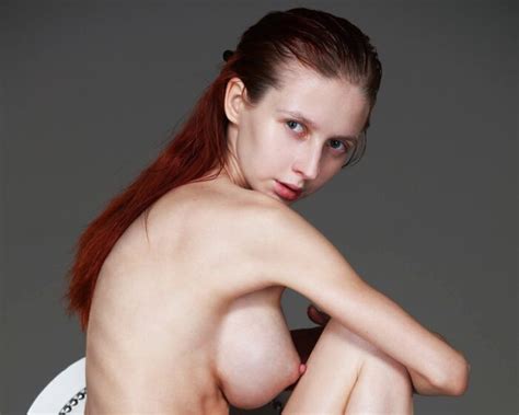 Busty Redhead Helga Grey Posing Naked In The Chair Erotic Beauties