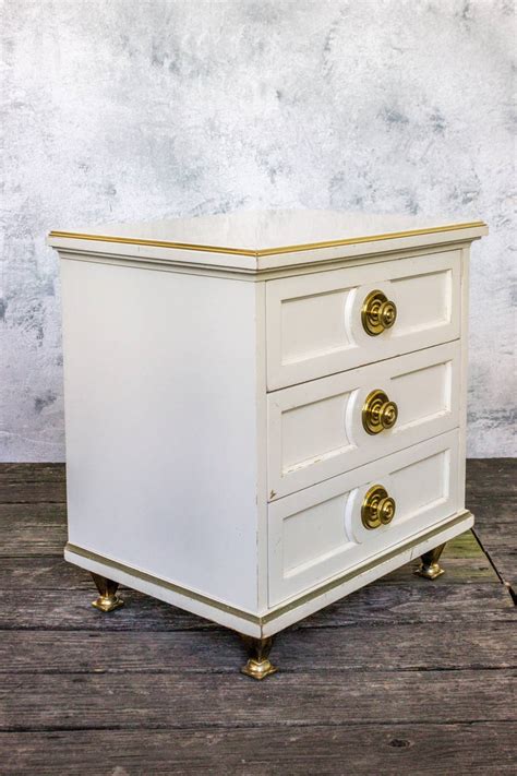 Single White Lacquered Mid Century Modern Nightstand With Brass Trim At