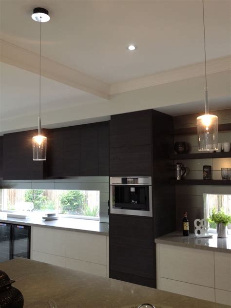 A corner display cabinet can blend seamlessly into a room while still offering a wow factor. Kitchen cabinetry extends into dining room creating a ...
