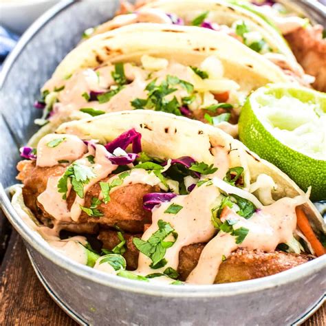 The Best Baja Fish Tacos Loaded With Citrus Slaw Avocado And Spicy