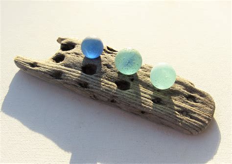 Three Blue Sea Glass Marbles On Driftwood A Unique Nautical Etsy Glass Marbles Blue Sea