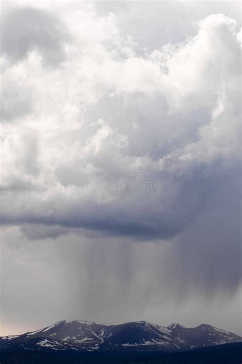 Dramatic Rain Storm Clouds Over Snowy Mountains Stock Photo Image Of