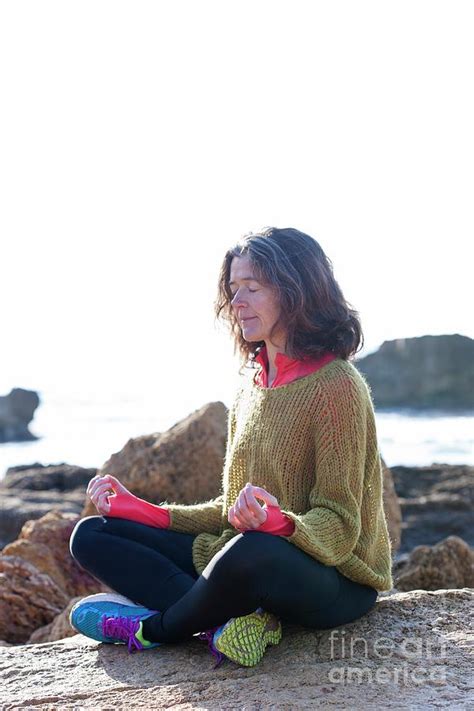 Woman Meditating Next To The Sea Photograph By Cristina Pedrazzini Science Photo Library Fine