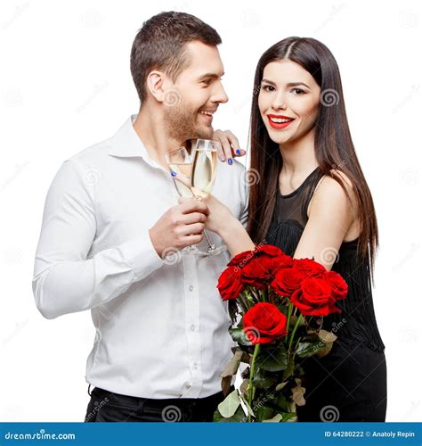 Young Beautiful Couple With Flowers Isolated On White Stock Photo