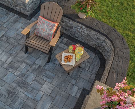 Cambridge stone pavers offer a sturdy alternative to bare ground, and can definitely be used as a finishing touch to any outdoor patio setting. Cambridge Ledgestone Smooth Paver Patio with Seating Wall
