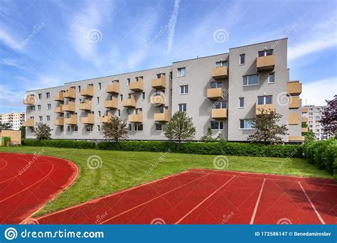 A Large Brick Building With A Athletic Track Stock Image