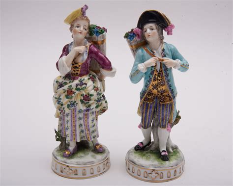 lot a pair of continental porcelain figurines 8 tall