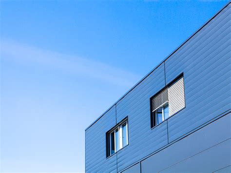 White Concrete Building Under Blue Sky During Daytime Photo Free Blue
