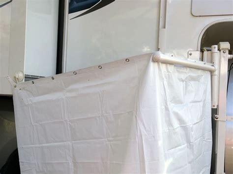 If you want a simple outdoor shower enclosure, take a large hula hoop like these 36″ ones, and attach a shower curtain to it! Outside Shower Curtain Enclosure - Truck Camper Magazine