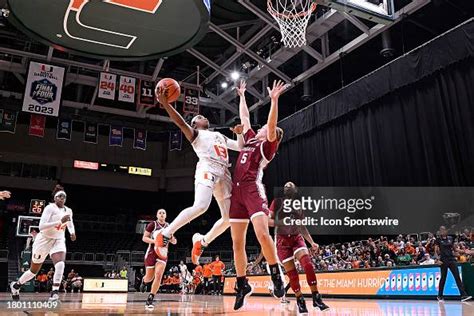 Miami Guard Lashae Dwyer Puts Up A Basket While Defended By Colgate