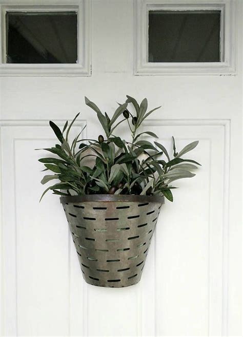Brighten up your wall, or place it over a door for a grand entry way display! Olive bucket, galvanized metal fixer upper style, Sunflower door hanger, wreath, wall decor ...
