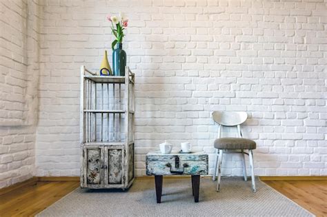 Premium Photo Table Chairs Shelves On The Background Of A White Brick