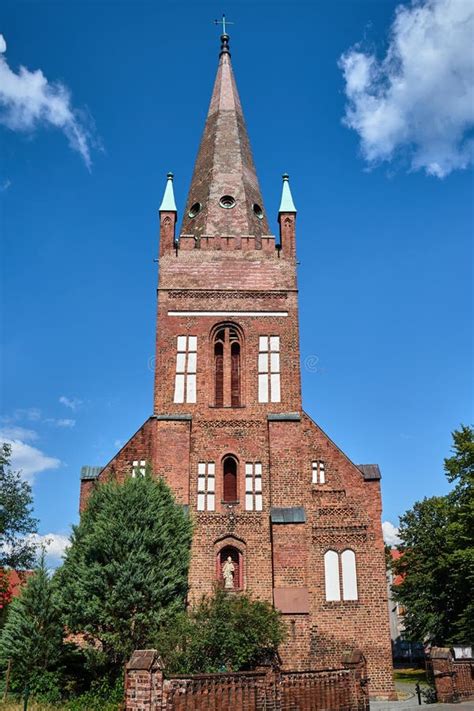 The Tower Of The Historic Gothic Red Brick Church In The City Of