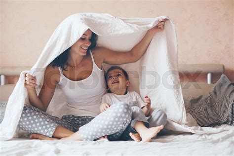 mom relaxing with her little son stock image colourbox