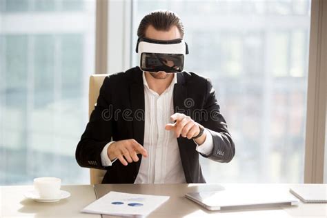 Businessman In Vr Headset Working In Augmented Reality In Office Stock Image Image Of Degrees