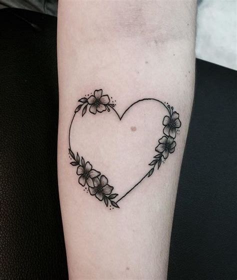 A Medium Heart Tattoo With Flowers Like The Wreath Heart Flower