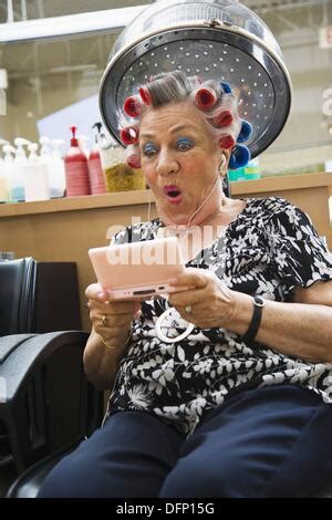 Older Woman In Hair Salon Having Hair Cut And Styled By Hairdresser Stock Photo Royalty Free