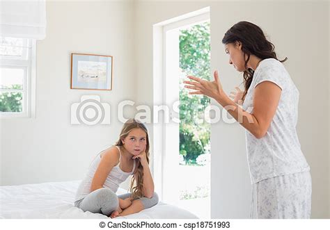Mother Scolding Daughter In Bedroom Young Angry Mother Scolding