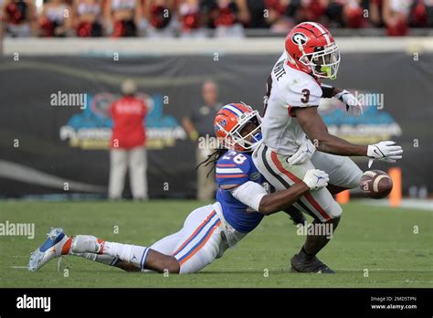 Florida Linebacker Tyron Hopper 28 Breaks Up A Pass Intended For Georgia Running Back Zamir