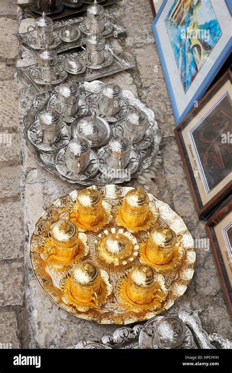 Display Of Gold And Silver Turkish Coffee Cups With Sugar Bowls And