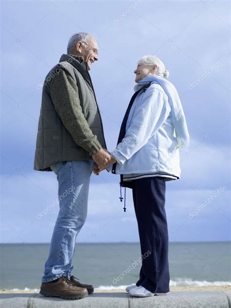Senior Couple Holding Hands — Stock Photo © Londondeposit 33820645