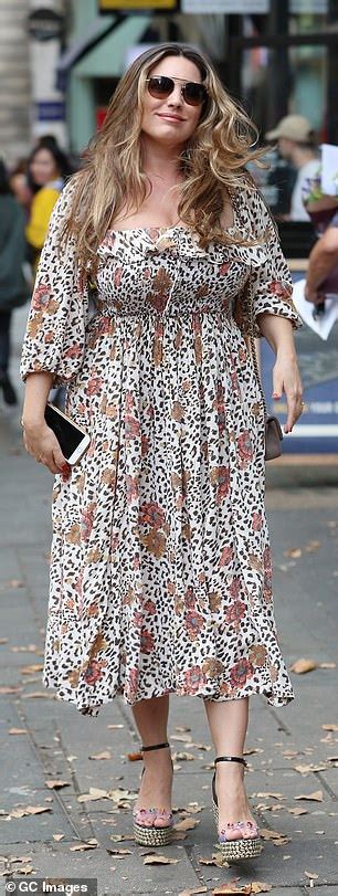 Kelly Brook Puts On A Busty Display In A Flowing Leopard Print Dress Daily Mail Online
