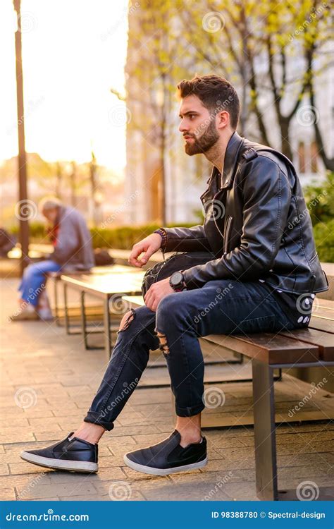 Young Man Sitting On A Bench Stock Photo Image Of Sitting Handsome