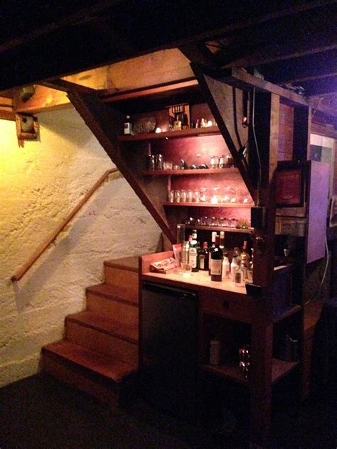 You need to decide what goes under the lowest part of the stair tread and what part of the kitchen needs the coveted space with the most generous headroom. Gregor and Violet's under-stair bar. | Bar under stairs, Staircase design, Bars for home