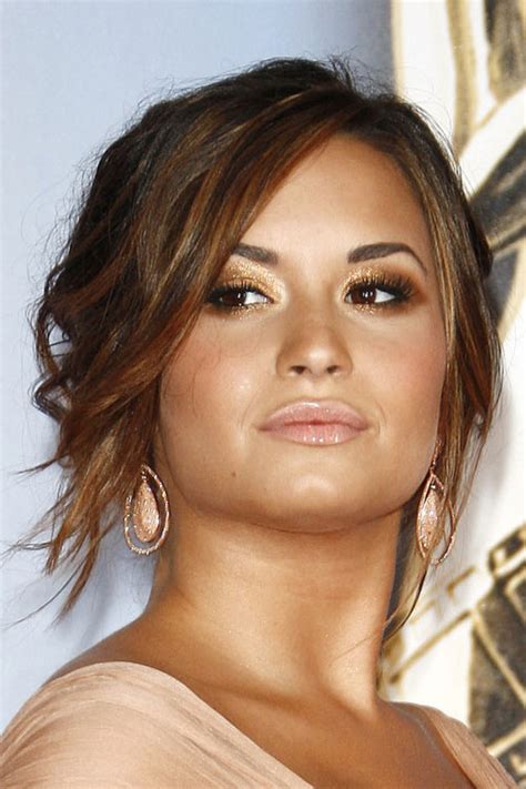 Adorable fishtail look at demi lovato in this picture. Demi Lovato Wavy Medium Brown Updo Hairstyle | Steal Her Style