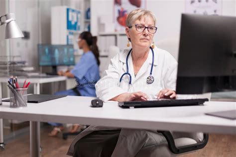 Experienced Doctor Using Computer Stock Photo Image Of Medical