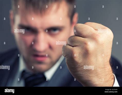 Angry Businessman Threaten With A Fist Stock Photo Alamy