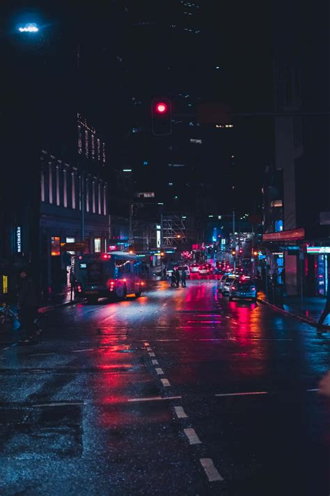 Download A City Street At Night With Traffic Lights