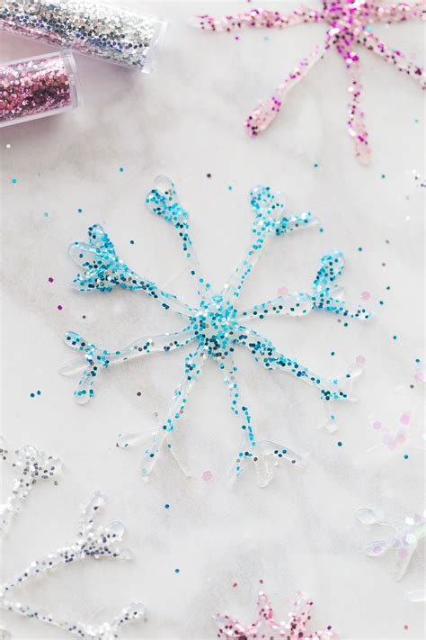 Whether you're looking for some sparkly ideas for christmas, fairy and mermaid crafts for girls or simply want a little extra bling and delight to your everyday. DIY Glitter Glue Snowflake Ornaments | Recipe | Diy snowflake decorations, Glitter projects ...