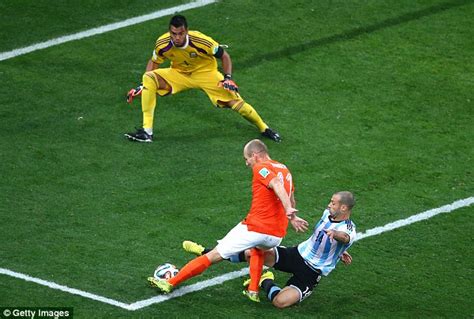 Netherlands' arjen robben (11) is challenged by argentina's javier mascherano (14) during the world cup semifinal soccer match between the netherlands and argentina at the itaquerao stadium in sao. Javier Mascherano made THAT tackle... can Argentina's ...