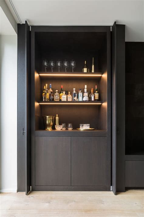25 cool and masculine basement bar ideas home design and interior. Pivot sliding doors conceal the bar | Moderne hausbar ...